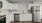 a kitchen with white cabinets