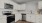 a kitchen with white cabinets