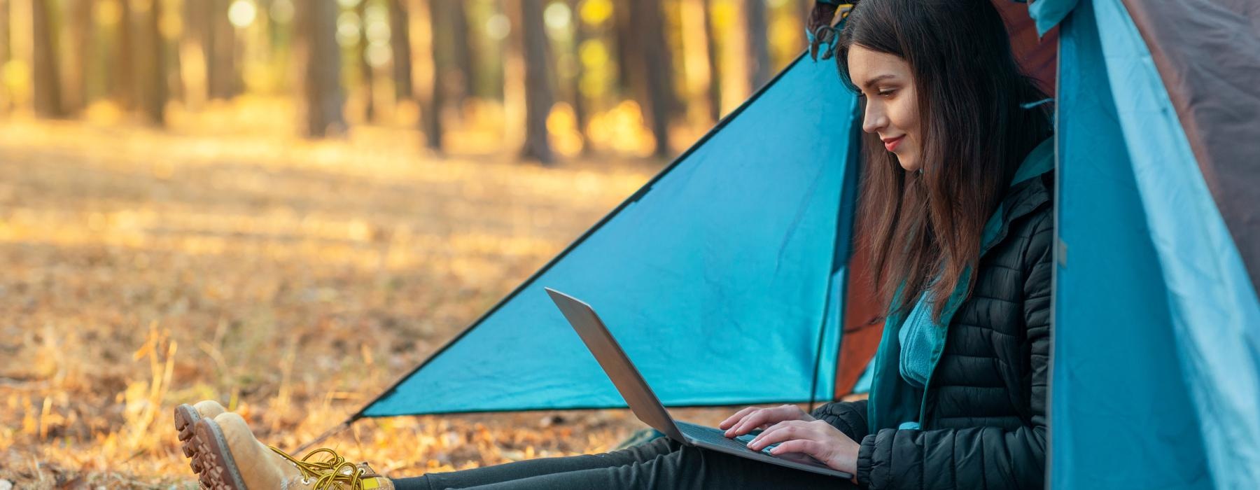 a person sitting in a tent
