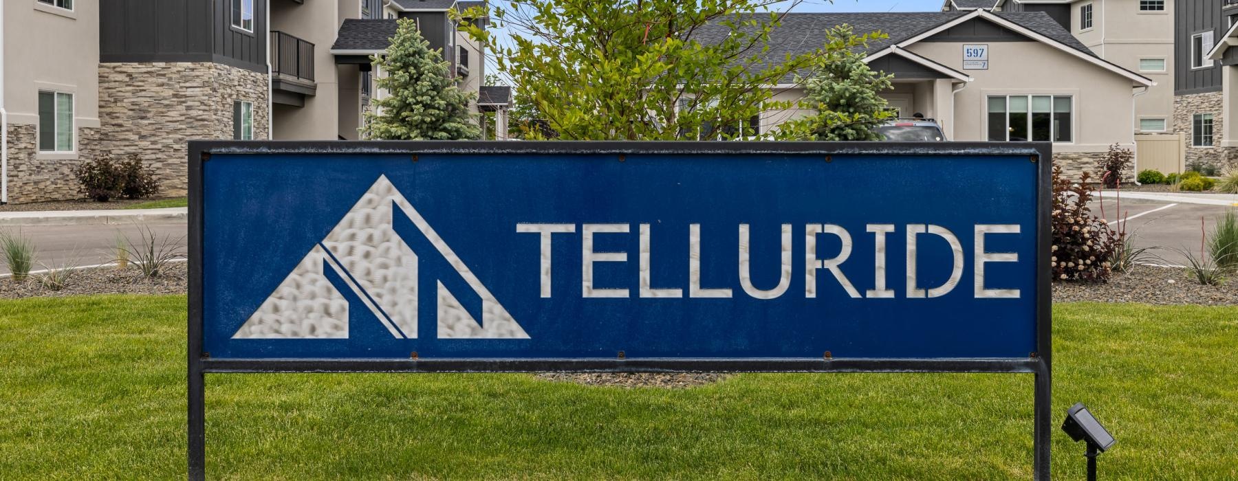 a blue sign in front of a building