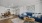 a living room with a blue couch and a table