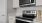 a kitchen with a stove and microwave